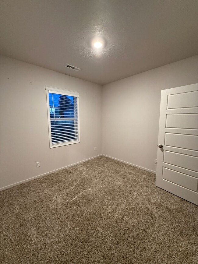 Building Photo - New Construction 4 Bed Mead School District Rancher w/ Fully-Fenced Yard and Attached Garage!