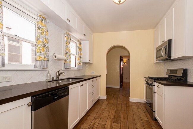 Building Photo - Beautifully Restored 3BR Miracle Mile Duplex | 1,725 SF | Near Metro D Line