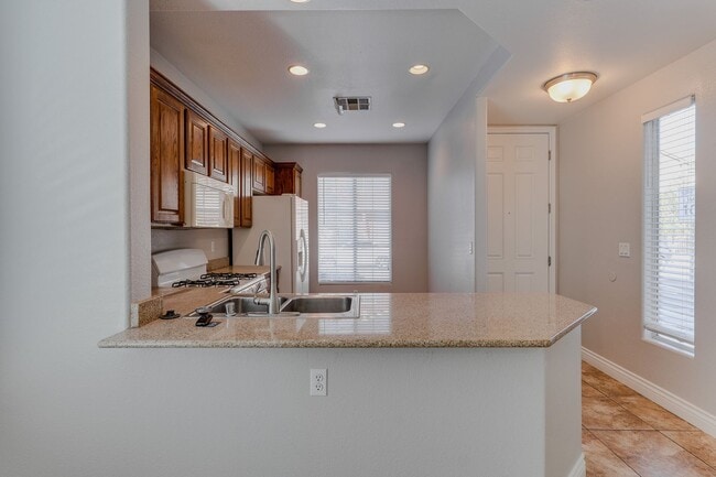 Building Photo - Gated Townhome with Strip Views from the Balcony!