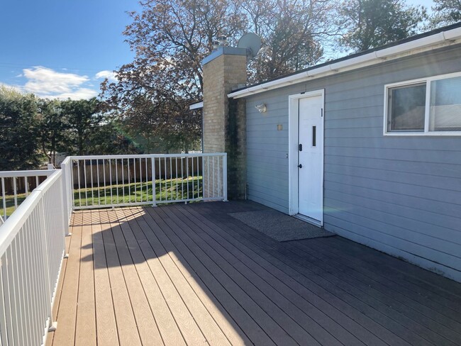 Building Photo - Spacious 4-Bedroom, 2-Bath Home with Daylight Basement, Large Yard & Two Fireplaces!.
