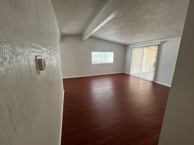 Building Photo - Single story home with large backyard and huge carport with plenty of storage.