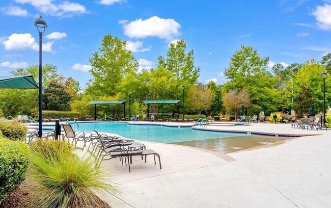 Building Photo - Charming Townhome with Open Layout, Back Patio & One-Car Garage – Near RTP, RDU & Everyday Conven...