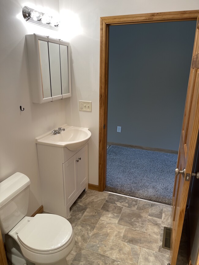 1/2 Bath between Living Room and Kitchen - 118 Willadine Dr