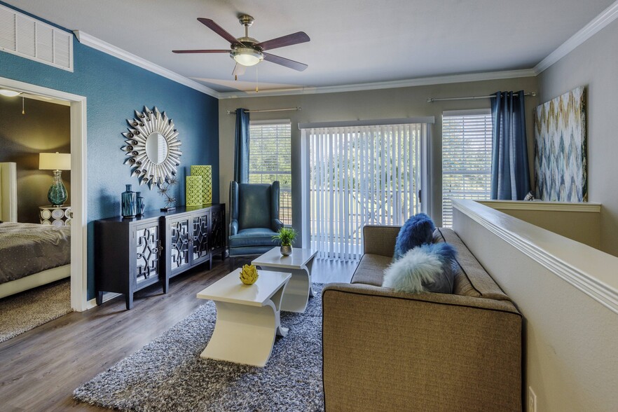 Spacious Living Room with Oversized Windows - The Meadows at North Richland Hills Apartm...