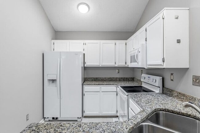 Building Photo - NW - Updated Home with Granite Counter-tops, Fire Place, Deck, Storage Building, Garage!