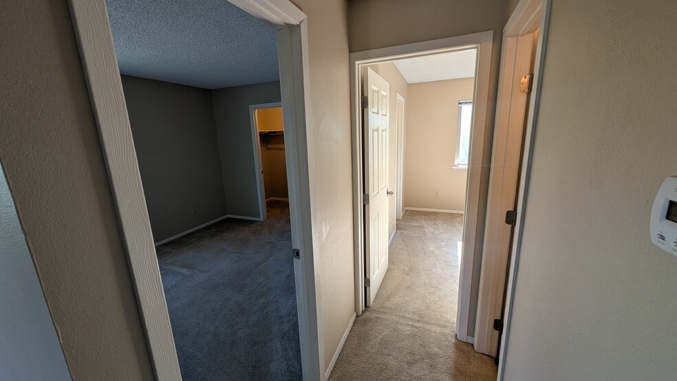 Hallway View into Bedrooms - 6690 Pahokee Ct