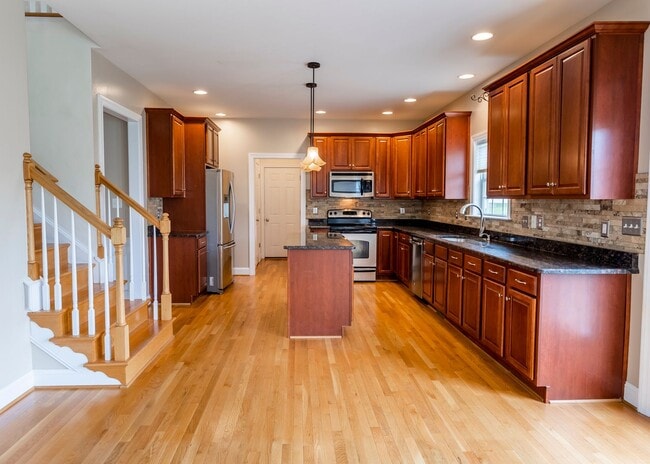 Building Photo - Huge house with vaulted ceilings and fenced in rear yard