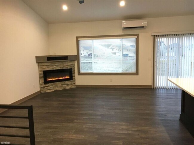 Building Photo - Spacious 4 bedroom/3 bath home with finished lower level and attached 2 car garage