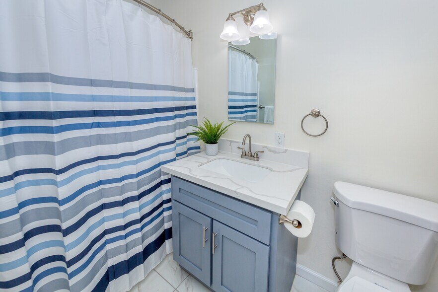 Upgraded Bath-quartz sink, marble floors, ample built-in shelves - 2232 S Carmelina Ave