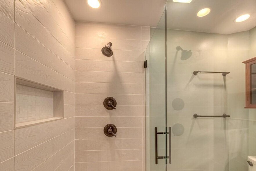 Great water pressure in this master shower along with tankless water heater so it’s always hot! - 408 Woodland Shores Rd