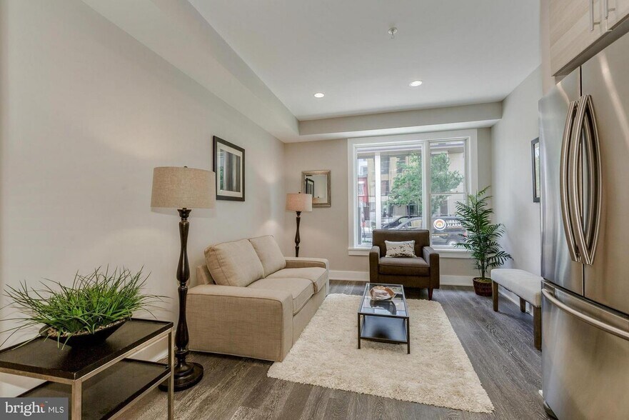 Living room staged - 703 Newton Pl NW