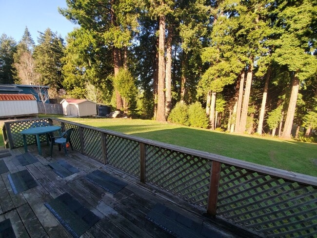 Building Photo - Spacious 1 bedroom with deck, wooded view & garden area. Most utilities included.