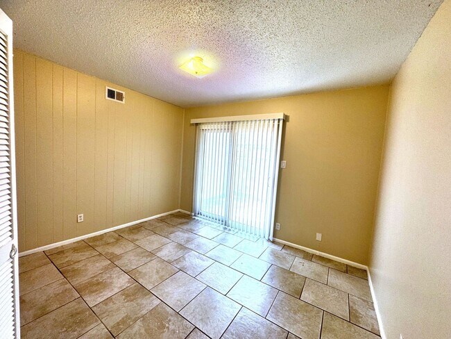 Building Photo - Single-level living on ground floor  |  Fresh paint (July 2026)  |  2 carports  |  Community Pool...