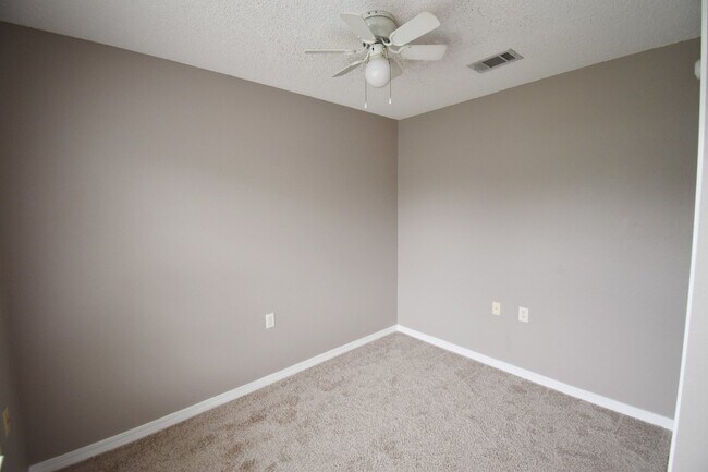 Building Photo - 2BR Patio Home with Open Layout, LVP Flooring, Private Fenced Yard, HOA Lawn Care & Convenient Bl...