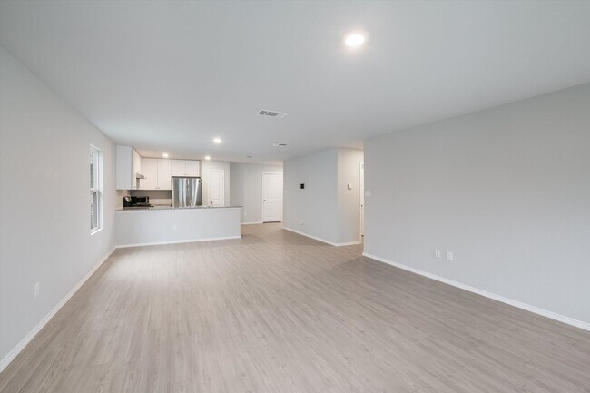 Building Photo - Open-Concept Living with New Flooring