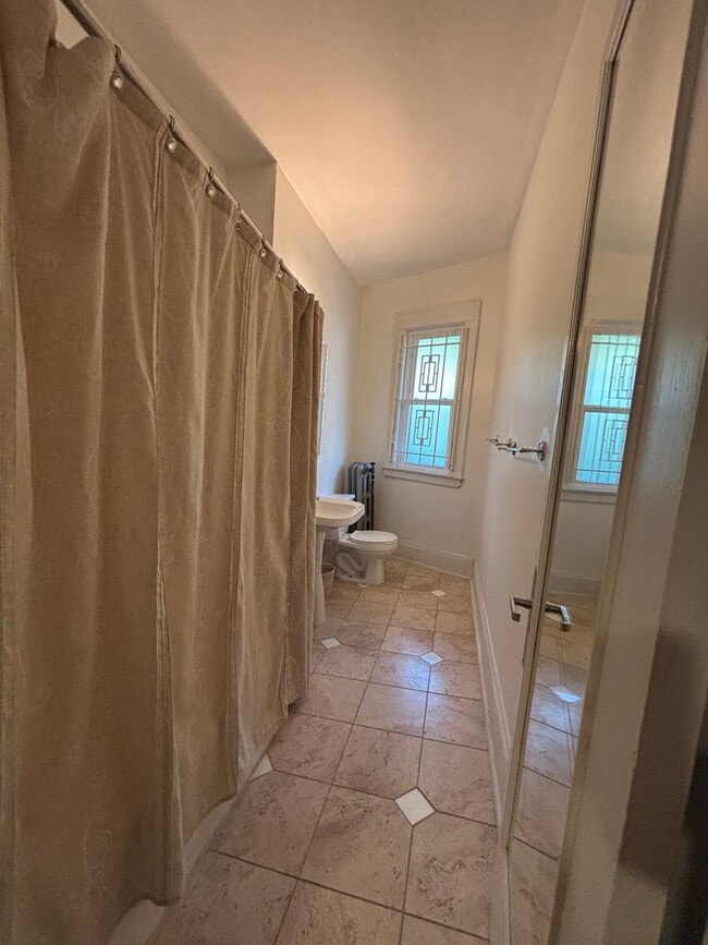 Building Photo - Vintage Beauty, Modern Living – Historic Condo Awaits!