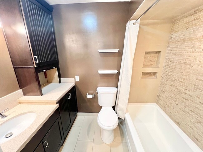 Building Photo - Contemporary 2 Bed Condo with 2 Garage Parking Spaces, Community Pool, and 3 Private Balconies