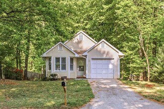 Building Photo - NW - Updated Home with Granite Counter-tops, Fire Place, Deck, Storage Building, Garage!