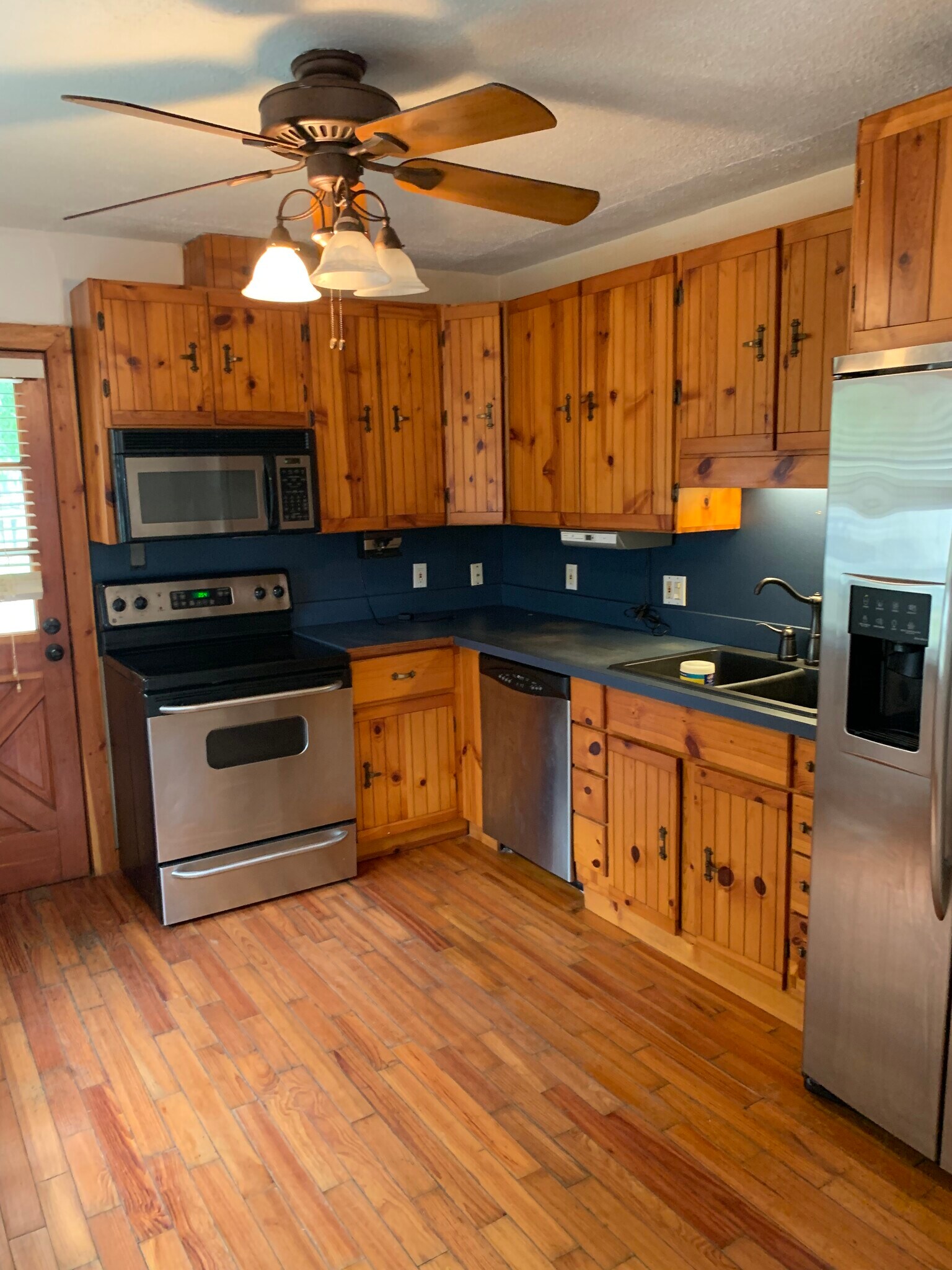 solid wood Cabinets with newer appliance. - 4911 23rd St W