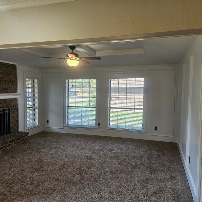 Building Photo - Three bedroom and two bathroom nicely remodeled with new flooring. Large wood fenced backyard