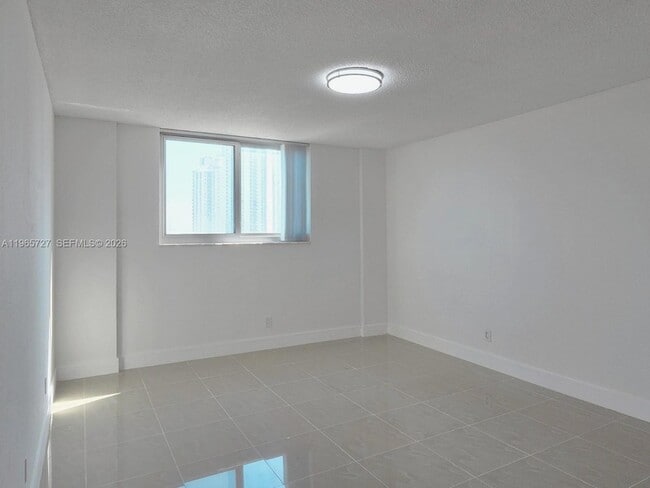 Building Photo - 19380 Collins Ave