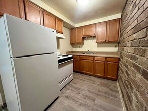 Building Photo - Second Floor One Bedroom Apartment! Built-In A/C, Off-Street Parking & More! Call Today!