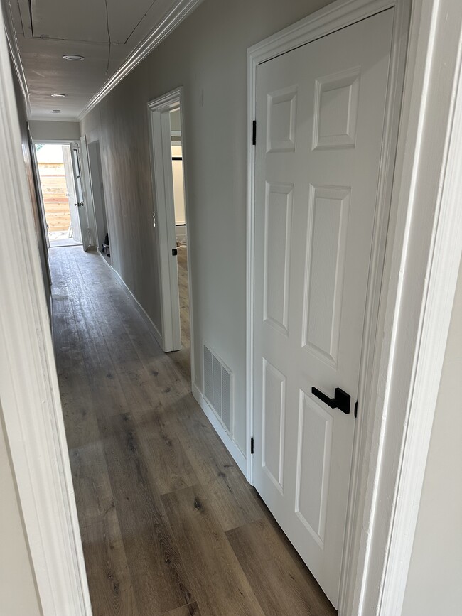 Hallway with storage closet, overhead recessed lights, laundry nook - 4230 W 169th St