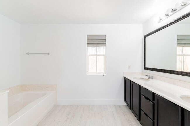 Building Photo - Immaculate 4 bedroom, 2 and 1 3/4 bath home located in the exclusive Master Planned Community Ins...