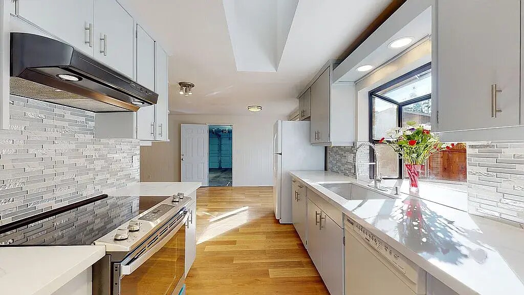 Remodeled kitchen with new sink, stove, dishwasher - 7302 139th PL NE