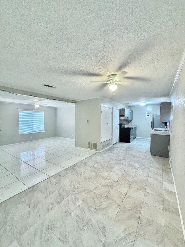 Building Photo - NOW AVAILABLE - Spacious 3-Bedroom Home + Fenced Backyard & Storage Building!