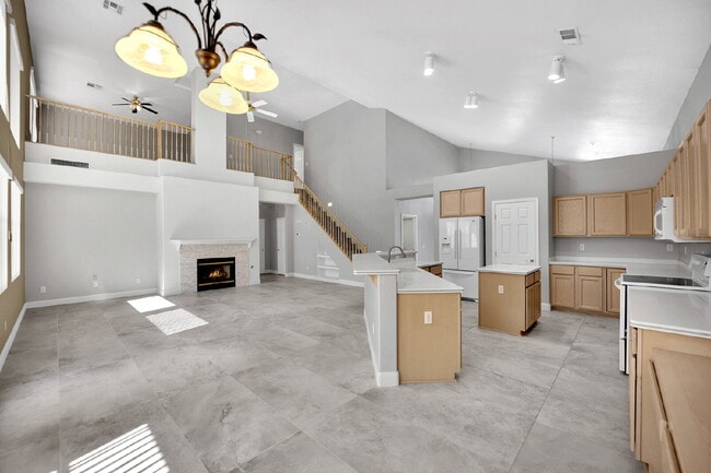 Building Photo - Spacious 4-bedroom, 3-car garage home feat...