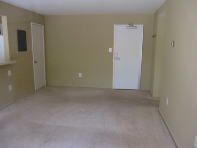 Living Room with a coat room and front door - 12 S Van Dorn St