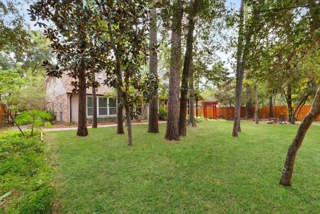 Building Photo - The Perfect Woodlands Retreat: Steps from ...