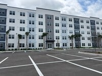 Building Photo - Modern 2 Bedroom + Den Condo Near The Mall at Millenia