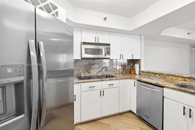 Building Photo - 6767 Collins Ave