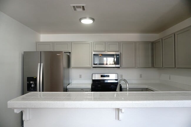 Building Photo - NEWLY RENOVATED 3BD/2BA CONDO W/ 2 CAR GARAGE