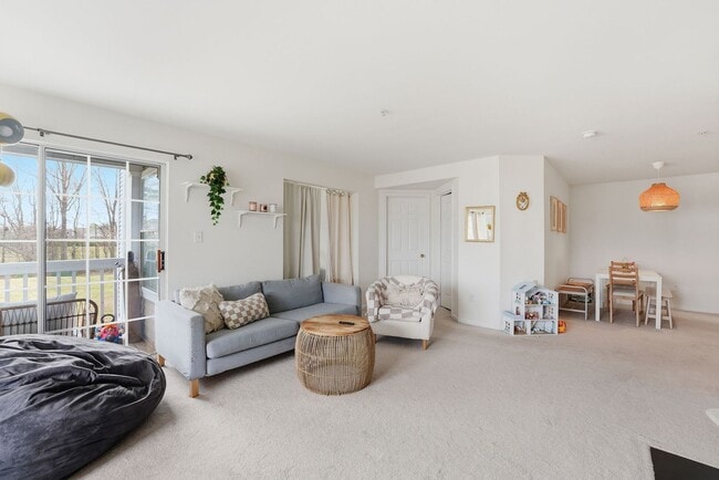 Building Photo - Bathed in natural light, this stunning second level condominium offers an effortless blend of com...