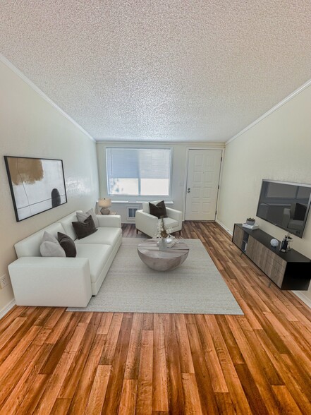 Step into spacious living rooms designed with large windows and versatile color palettes, ready to complement your personal style. - Whisperwood Apartments
