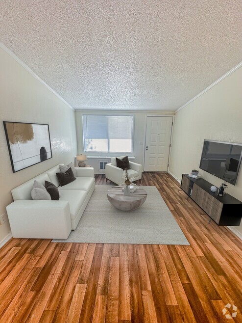 Step into spacious living rooms designed with large windows and versatile color palettes, ready to complement your personal style. - Whisperwood Apartments