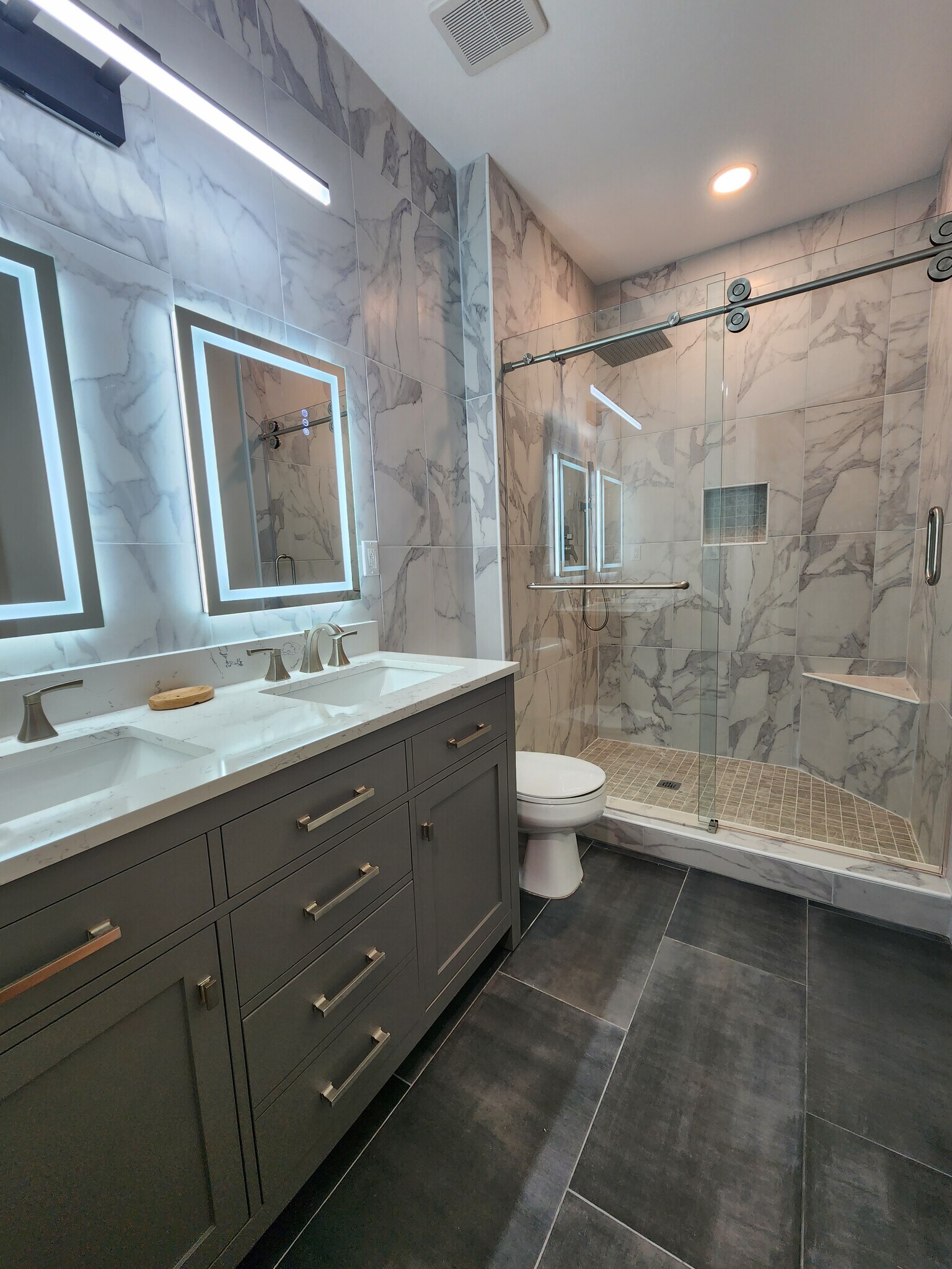 Walk in shower, sliding custom glass doors, premium ceramic tile floor and walls. - 5559 glenridge dr,
