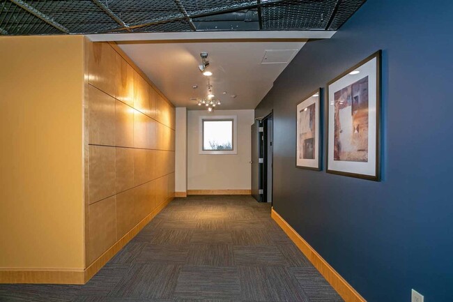 Building Photo - Gorgeous loft-style 2 floor condo with secured parking, A/C and rent includes most utilities!
