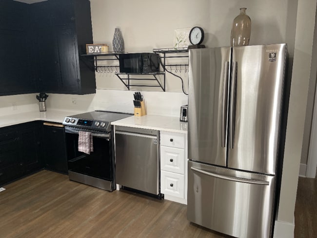 Building Photo - Renovated Fully-Furnished Duplex w/ Private Fenced Yard