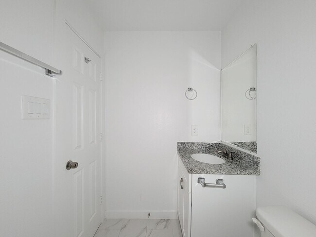Building Photo - This newly constructed 3-bedroom, 2-bathroom unit offers modern living with 1,150 sq ft of space....