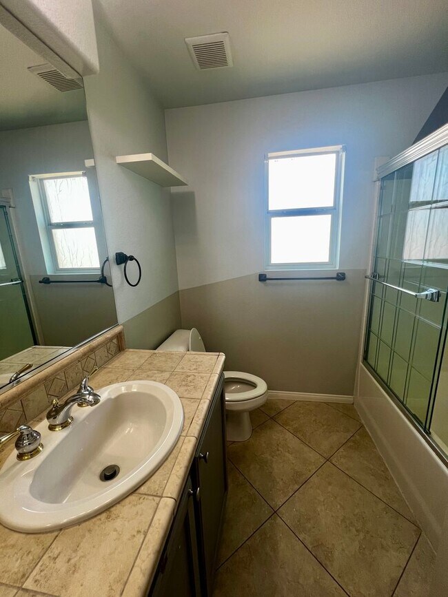 Building Photo - Spacious 4-Bedroom Mountains Edge Home with Downstairs Suite, Balcony & Covered Patio