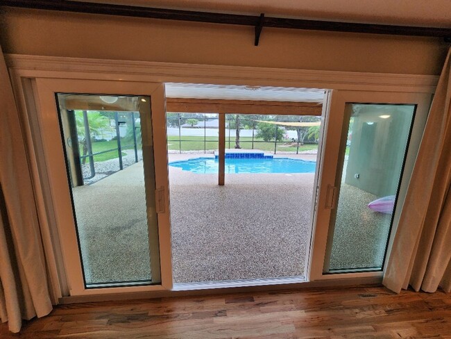 Building Photo - Gorgeous Riverfront 3/3 Saltwater Pool Hom...