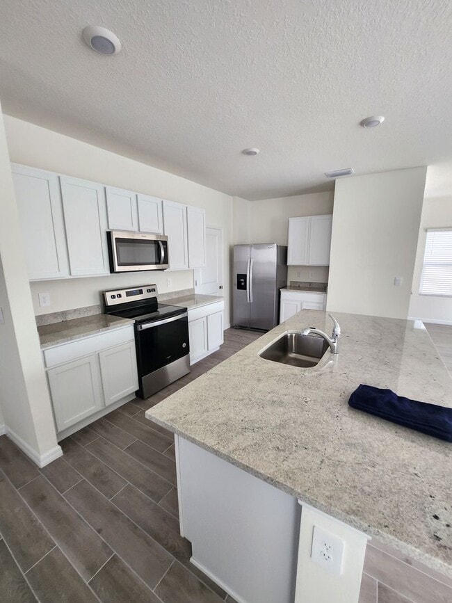 Building Photo - Spacious 4-Bedroom Modern Home in Oaks Preserve – Perfect Gainesville Location