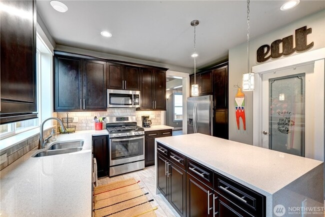 Building Photo - Luxury NW Living: 4 Bedroom Masterpiece with Dual Suites and Private Yard in Desirable Browns Point!