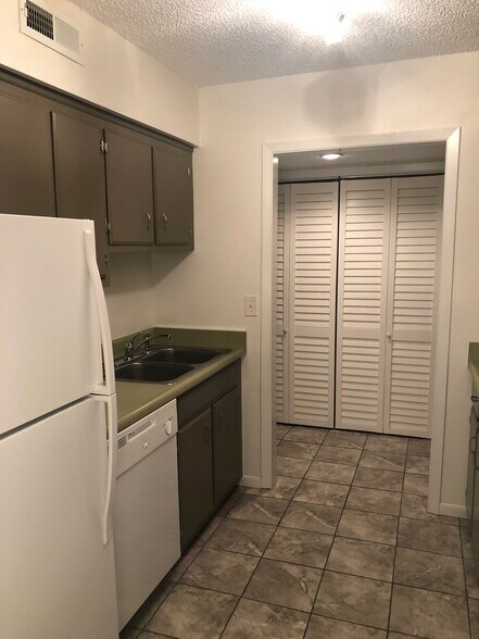 Kitchen has ceramic tile floor, Closet on the right is a pantry. - 515 Basswood Ave
