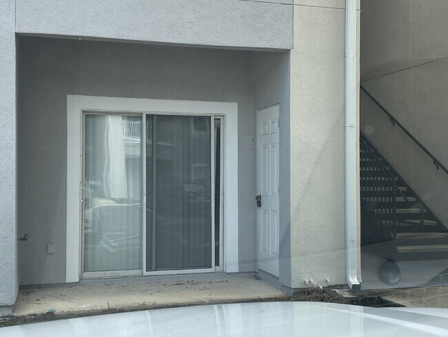 Building Photo - First-Floor 2BR/2BA Condo in Gated Nature’s Hideaway – Pool, Playground & Convenient Westside Loc...