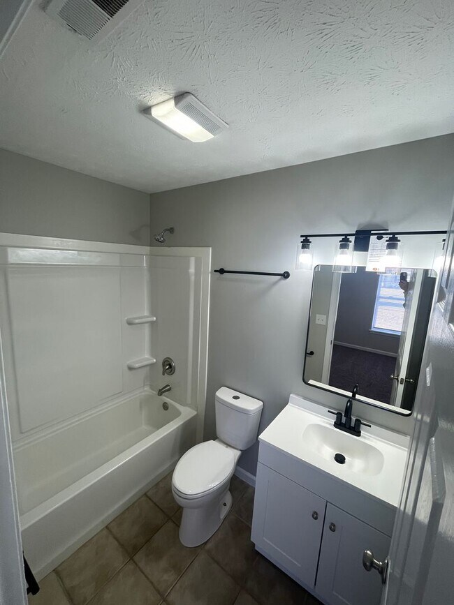 Building Photo - SUBLEASE - Three Bedroom Single Family Home with Fenced Backyard